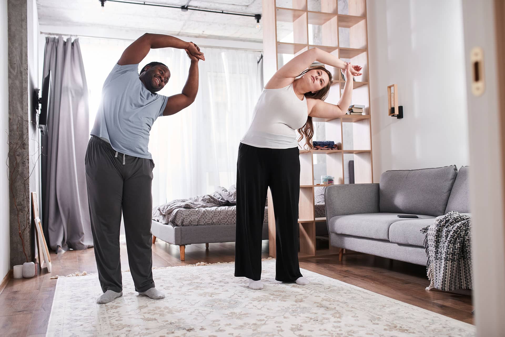 man and woman working out at home